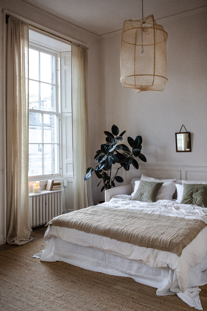Calm, natural bedroom decor with linen