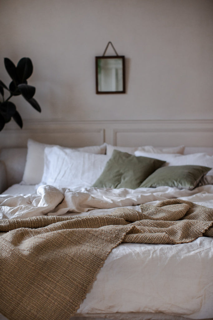 Handmade plant dyed merino wool blanket is natural caramel colour