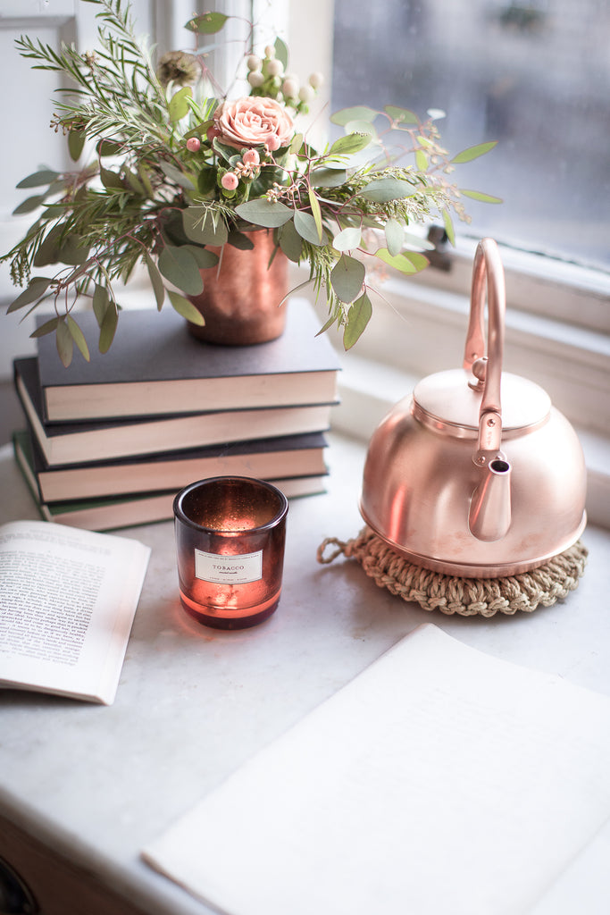 Copper kettle and copper cup flower vase