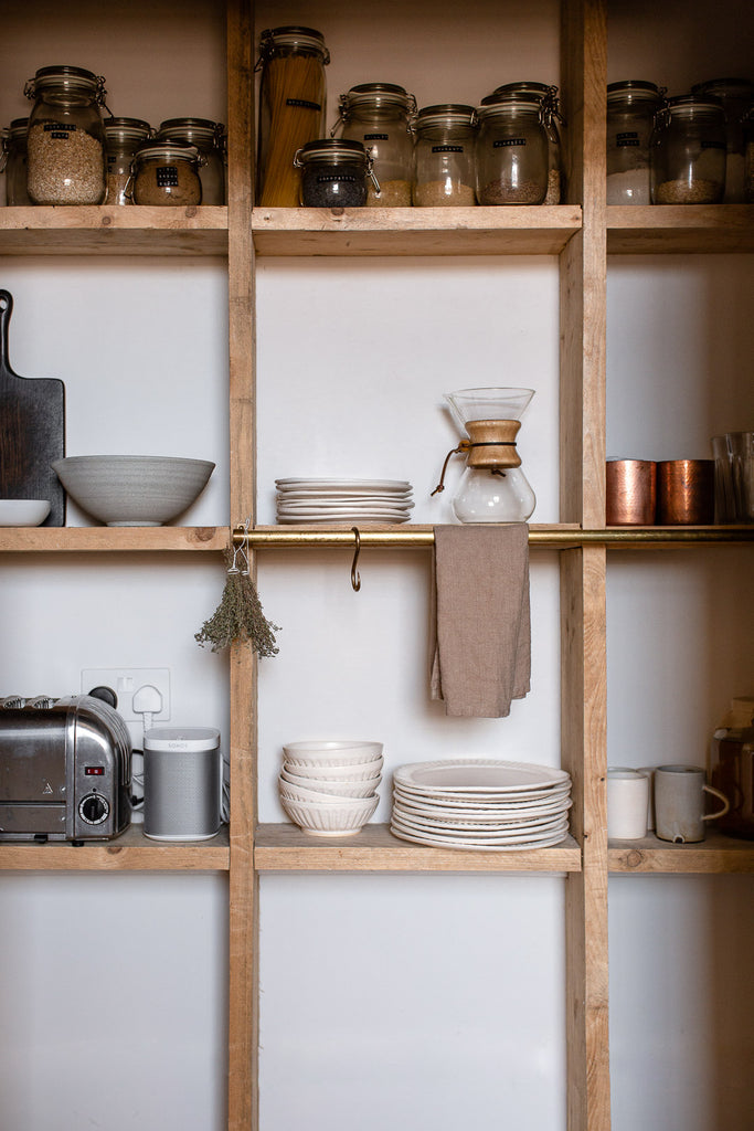 wooden kitchen pantry shelving with rustic decor