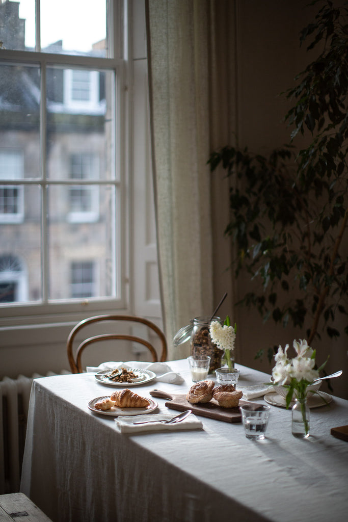 breakfast table under a large window