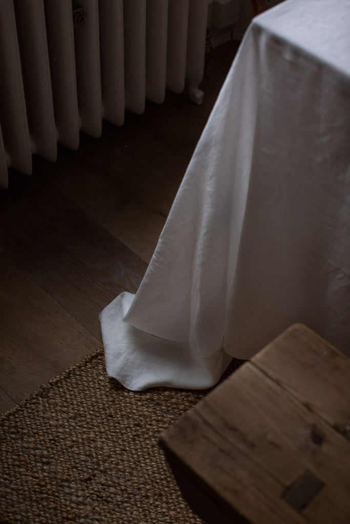 large handmade off-white linen tablecloth with boarder