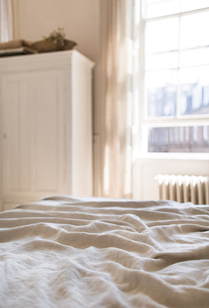 natural bedroom decor in neutral colours with linen