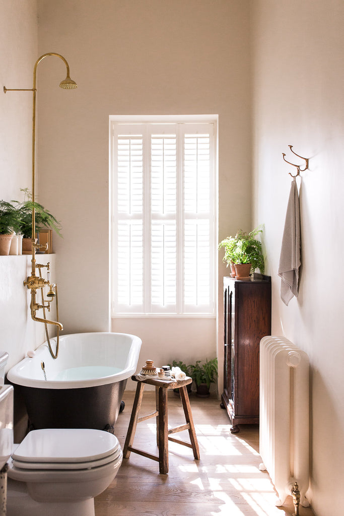 modern vintage bathroom with clawfoot bath tub