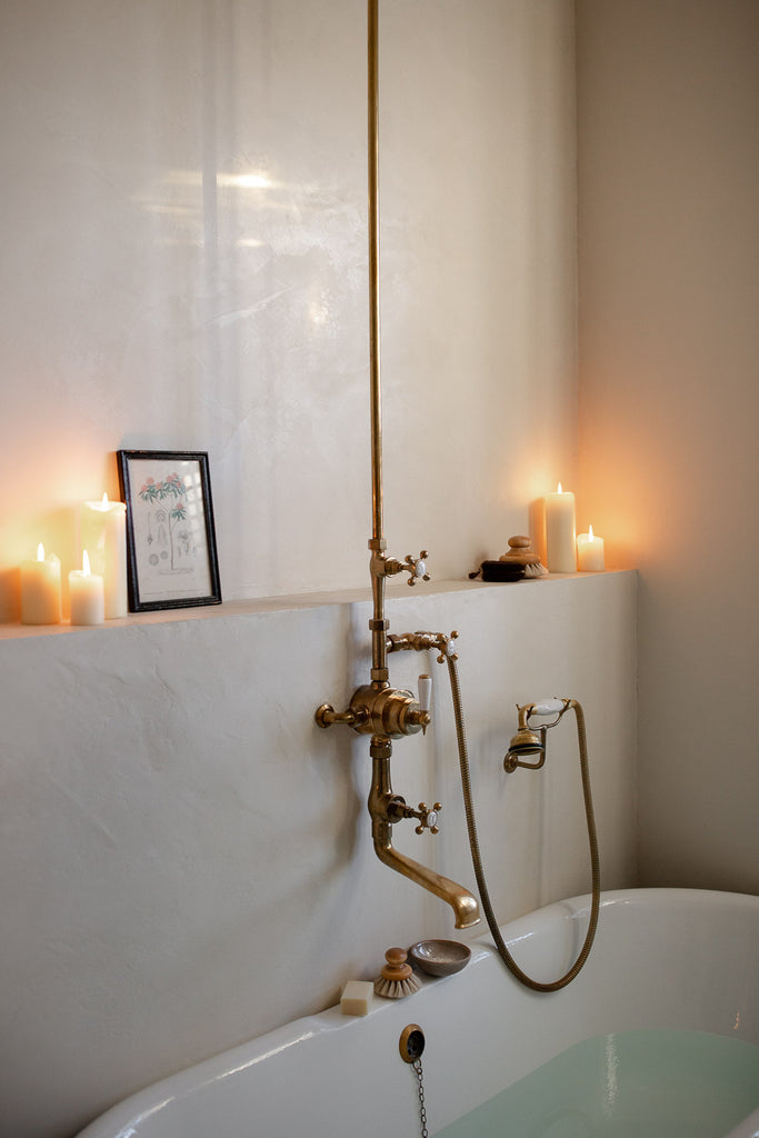 natural bathroom with brass taps 