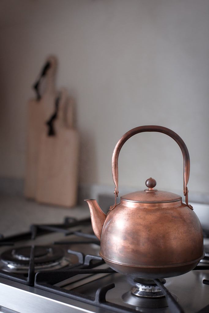 copper kettle with a patina