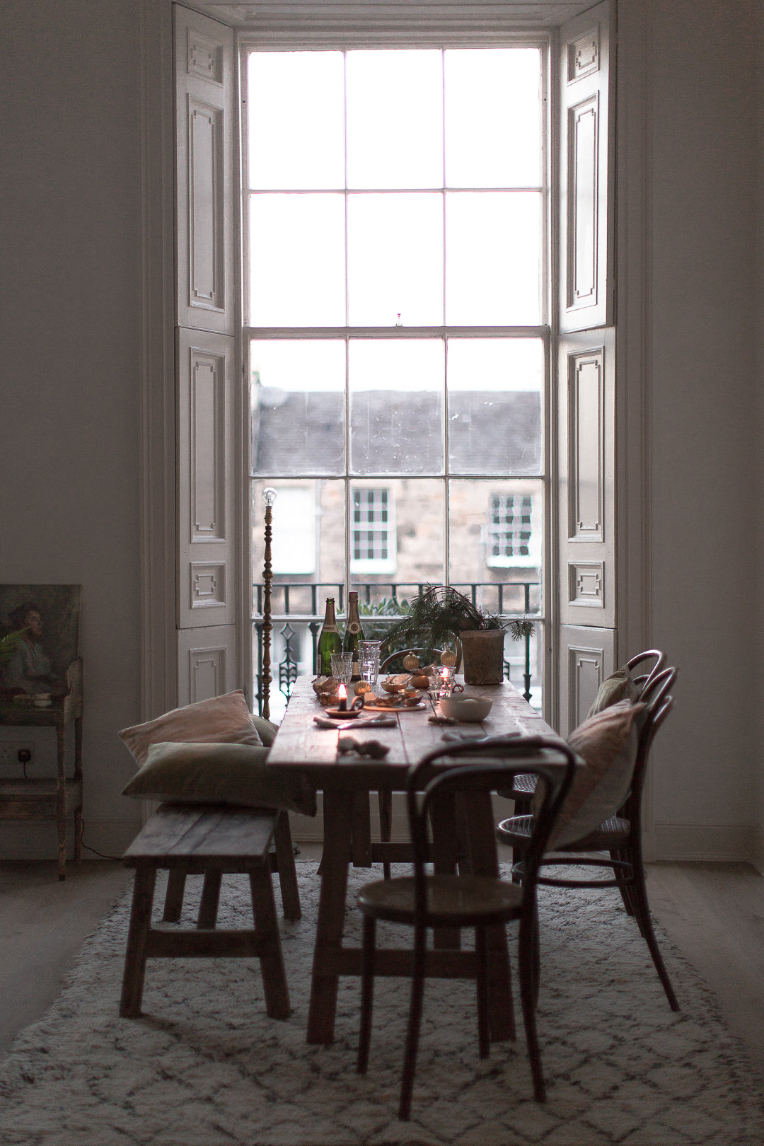 candlelit dinner by a big window  