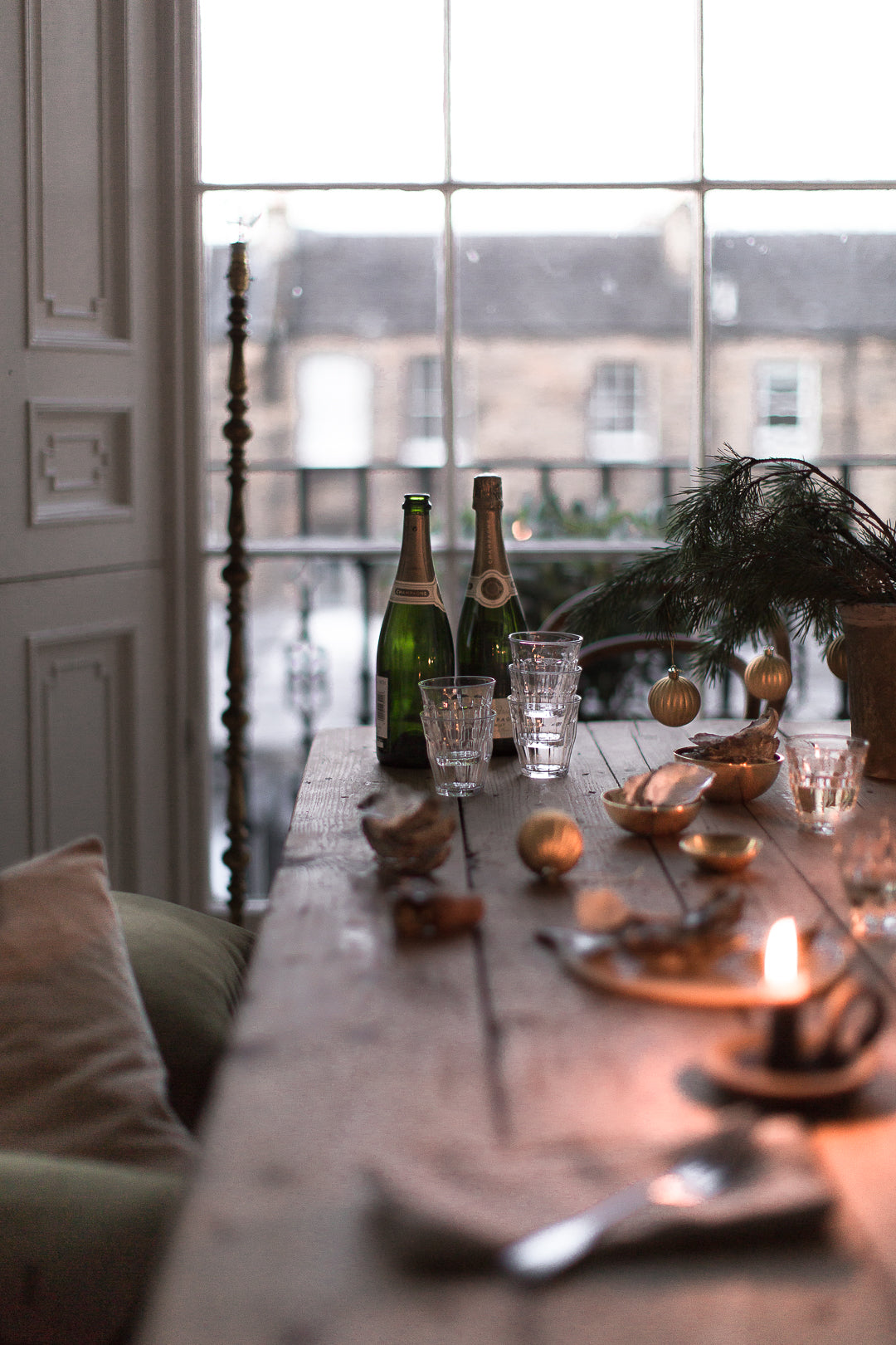 candlelit dinner by big window 