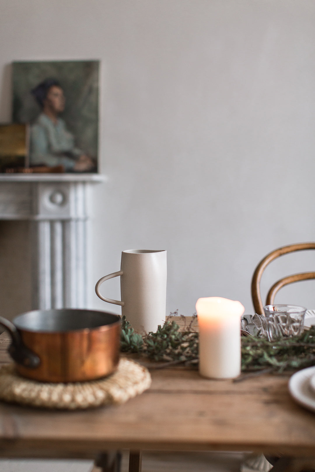 copper pot and straw trivet 