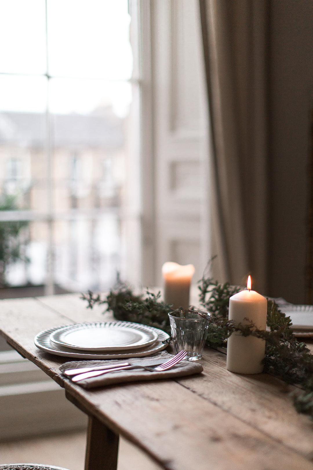 dining room table by a big window 