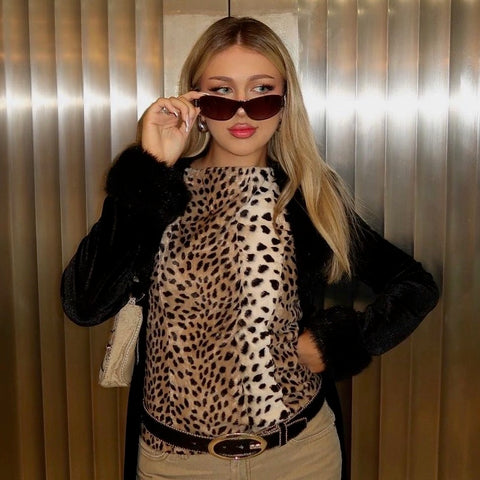 Blonde long haired girl wearing a cheetah top with Lucky Charm sunglasses from Giant Vintage