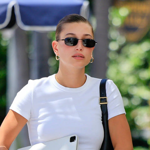 Hailey Bieber wearing white tee and NORBERT BLUE sunglasses from Giant Vintage