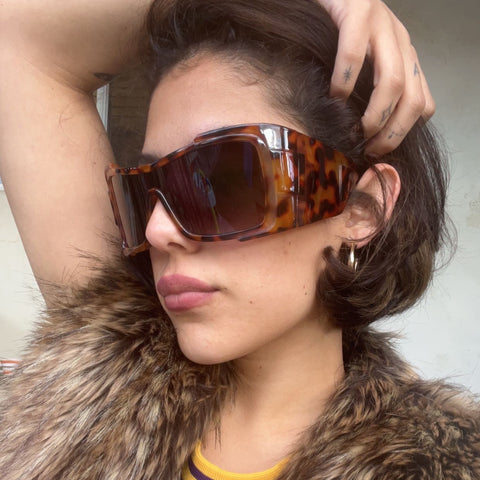 Stylish Brown haired girl wearing Geometric OMIKA style sunglasses from Giant Vintage