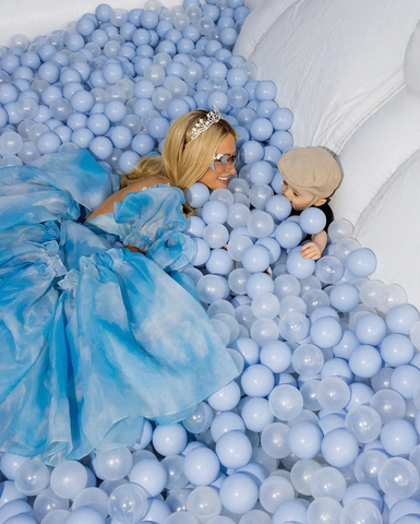 Paris Hilton wearing her BOOM style sunglasses in a ball pit with her son