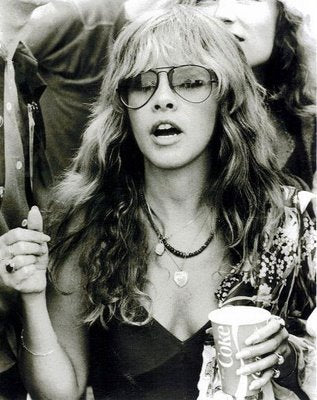 Stevie Nicks wearing aviator style sunglasses from Giant Vintage