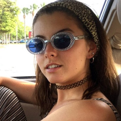 Girl posing in car with SPACELAND Blue Oval Sunglasses