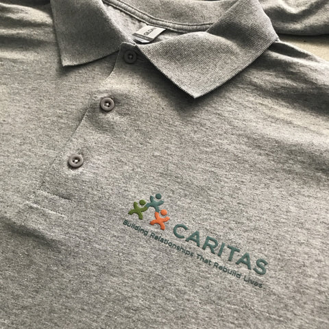 Caritas screen printed polos by RVA Threads.