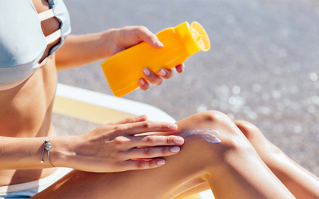 Applying sunscreen on skin