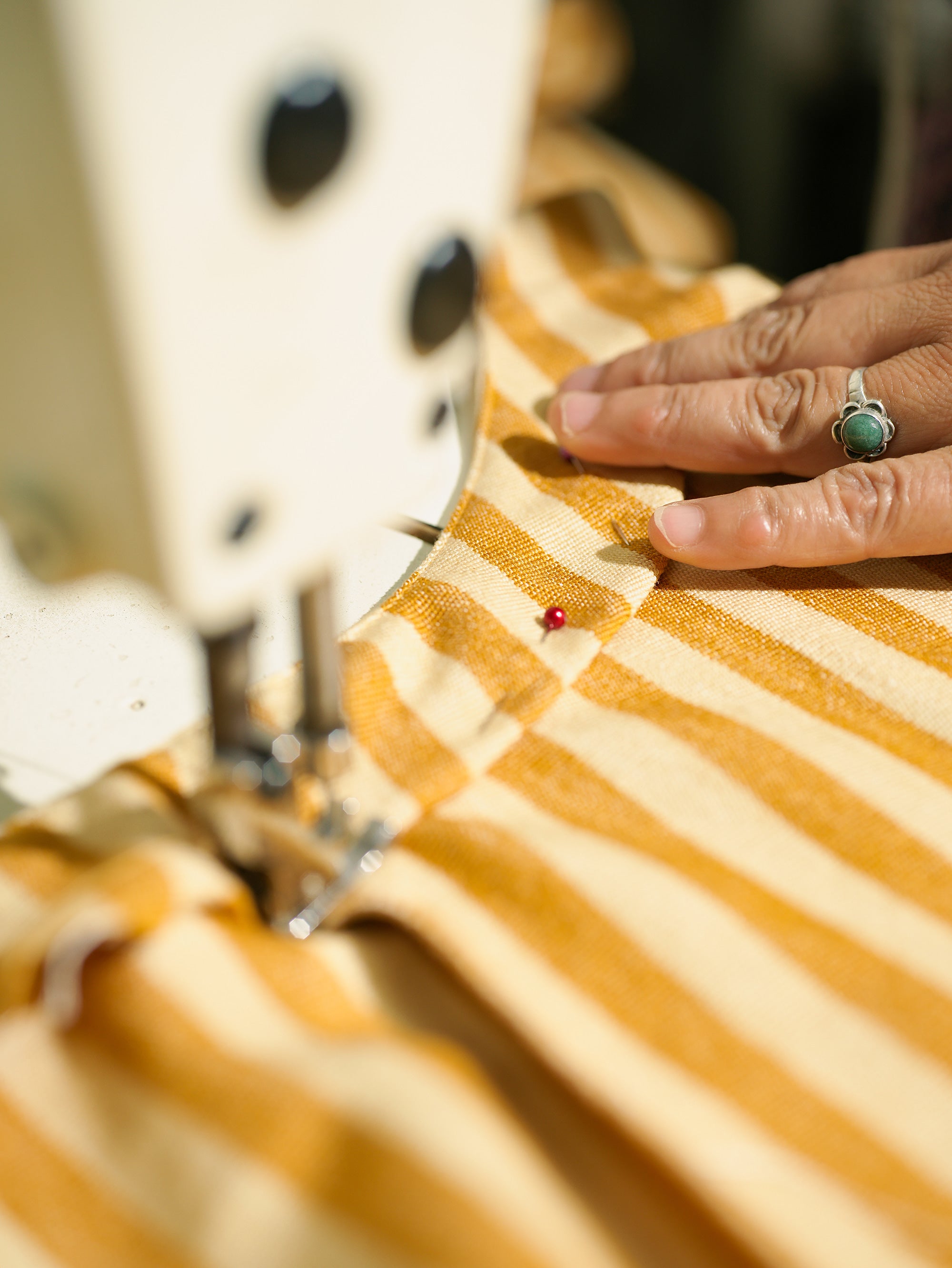 Irma pinning the 100% cotton fabric for the MINNA Utility Apron in Honey