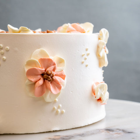 Korean-style lilac cake with piped flowers