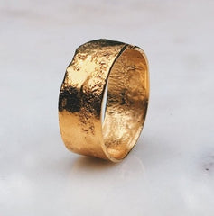 yellow gold raw textured wedding band by ringcrush