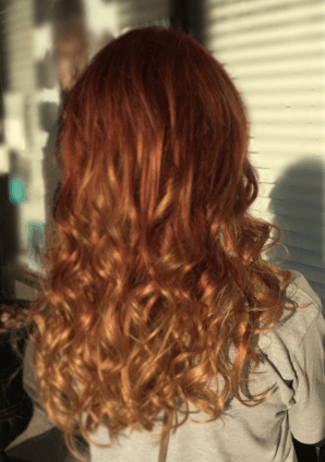 Girl wearing Copper Red Dirty Blonde Balayage Hair Extensions from Queen C Hair