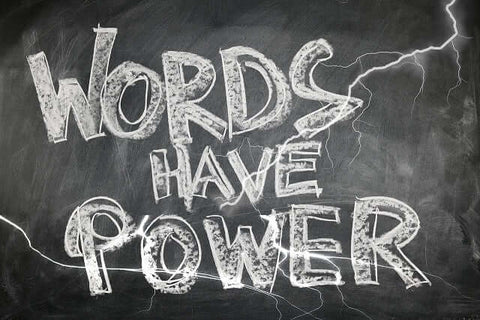 Blackboard with the words - Words have Power written in chalk.