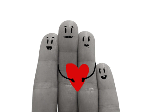 Image of 4 fingers with faces on holding a red heart, meaning love of family and friends