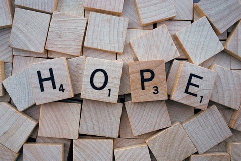 wooden tiles spelling the word HOPE