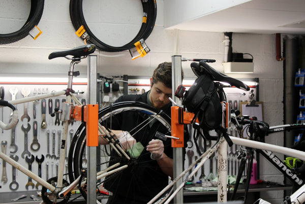 Man fixing bikes in London