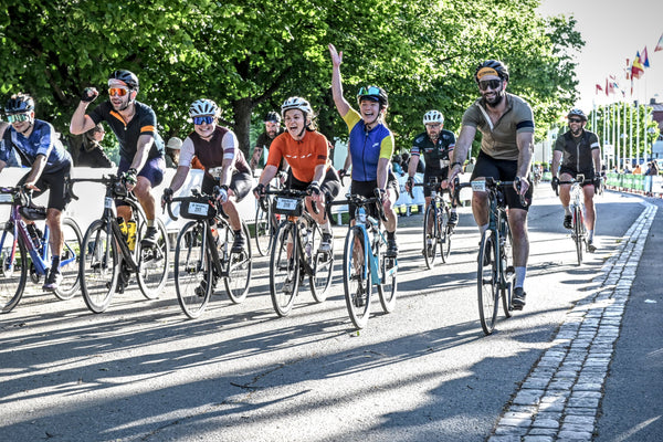 Cycling group celebrating finishing a ride