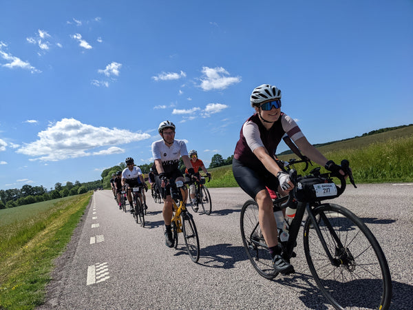 Female cyclist leading group of cyclists