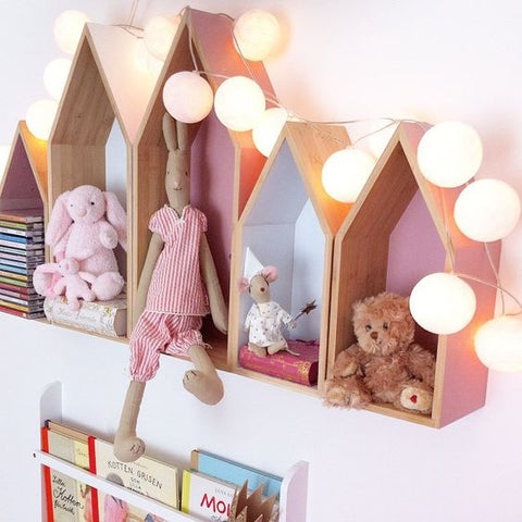teddies in house shaped box shelves