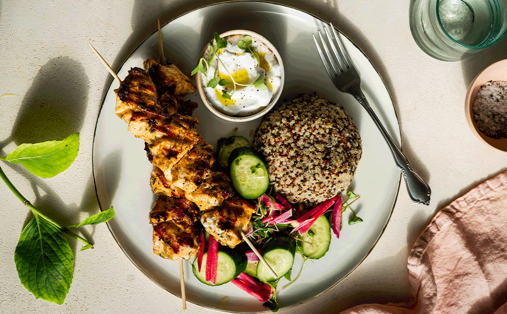 Yogurt Marinated Chicken Skewers served with sprouted quinoa and a radish & cucumber salad