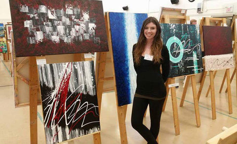 Nicole Nicholas showcasing her abstract art at the show
