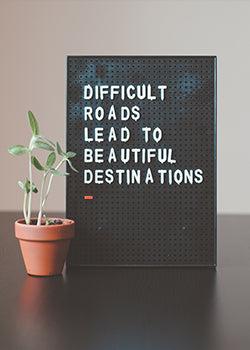 "Difficult roads lead to beautiful destinations" board 
