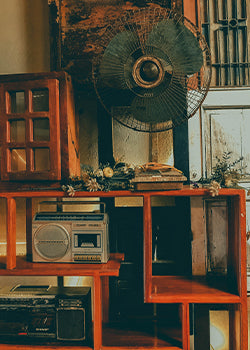 A shelf filled with old electronics 