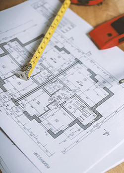 floor plans and a tape measure