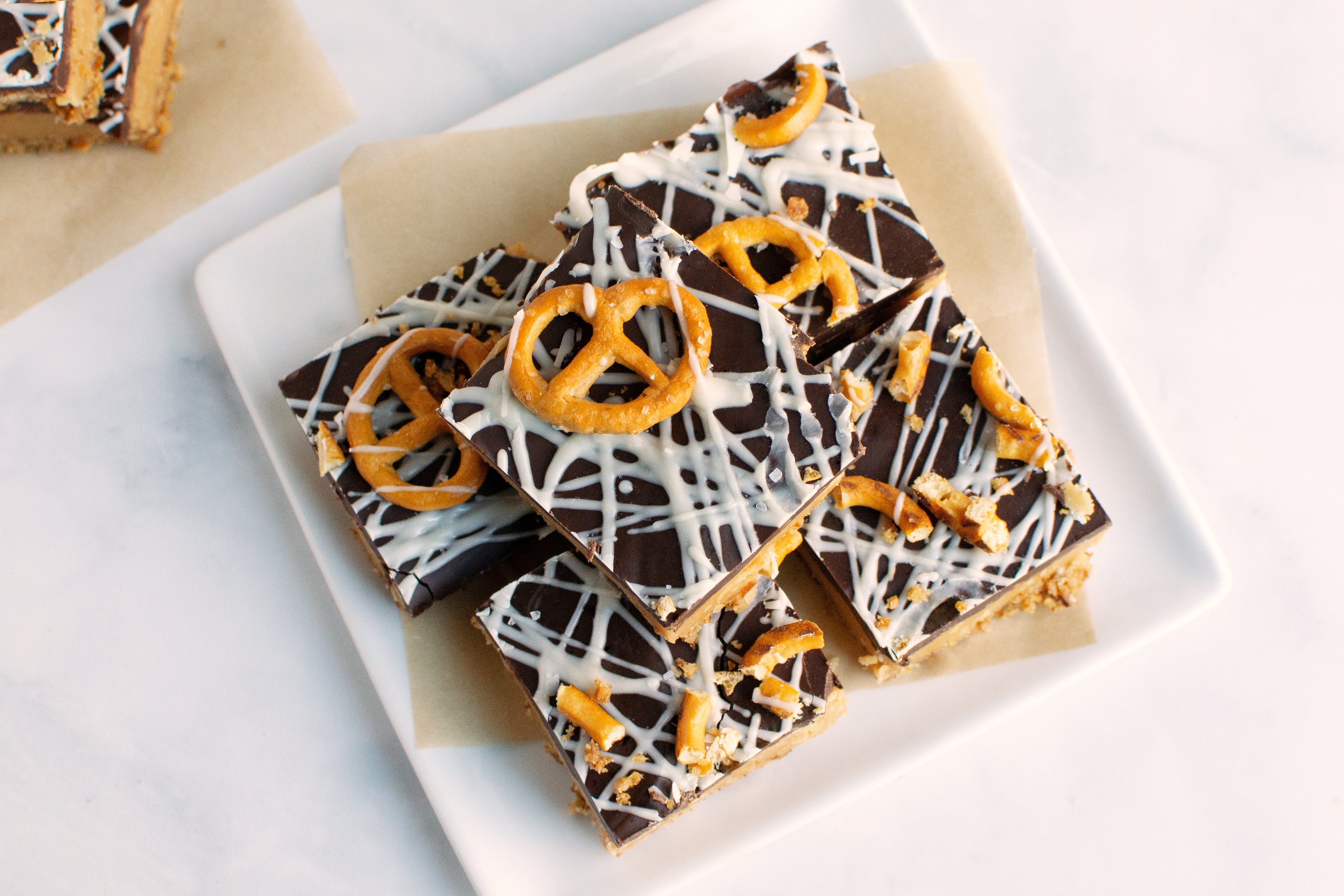 White Chocolatey Peanut Butter Fudge Bars with Salted Pretzel Crust