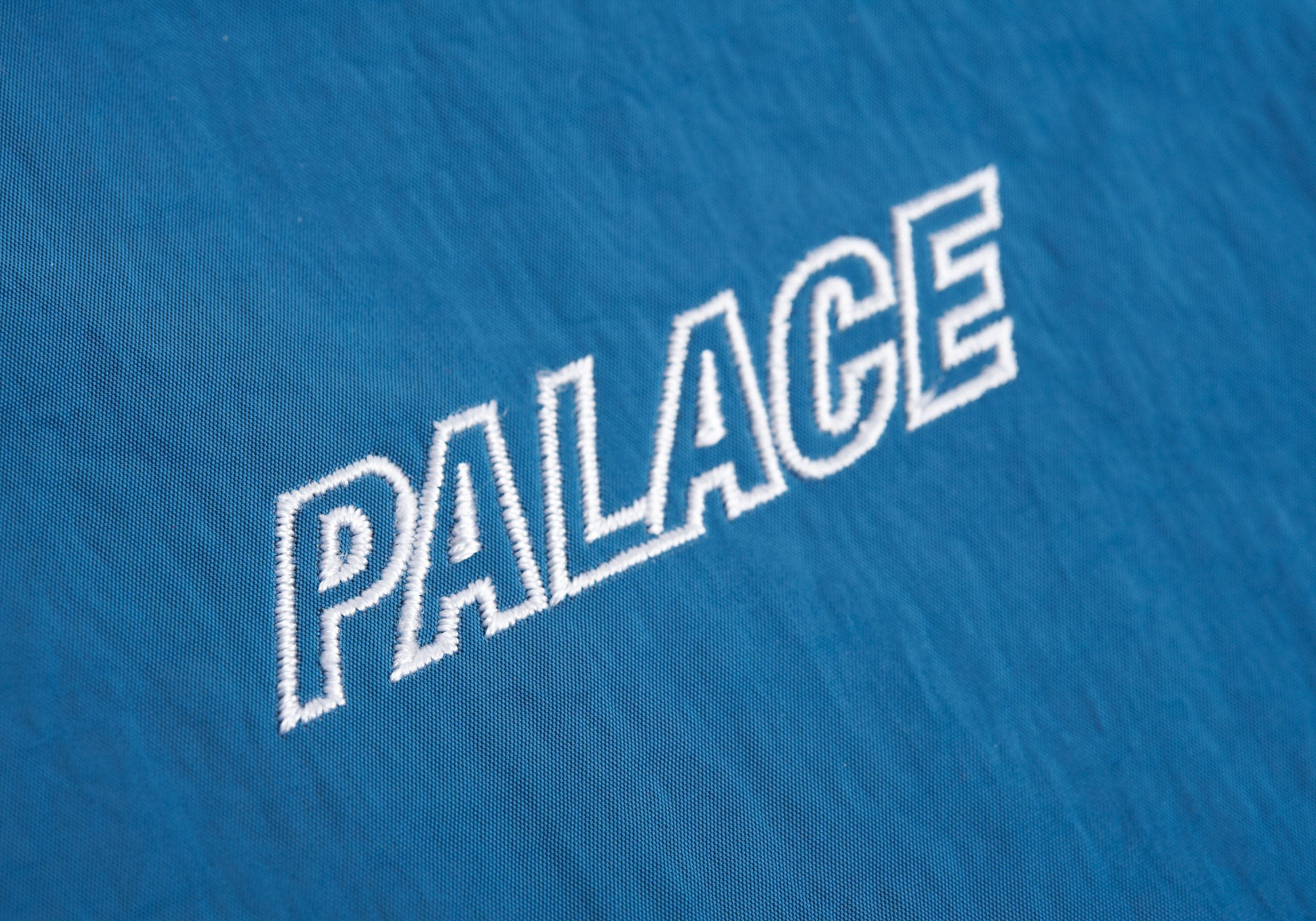 Palace-AW16-jacket-hood-logo-sleeve-blue-detail15707_a8a19e0c-c395-400c-b920-70a2db4f0bb6.jpg