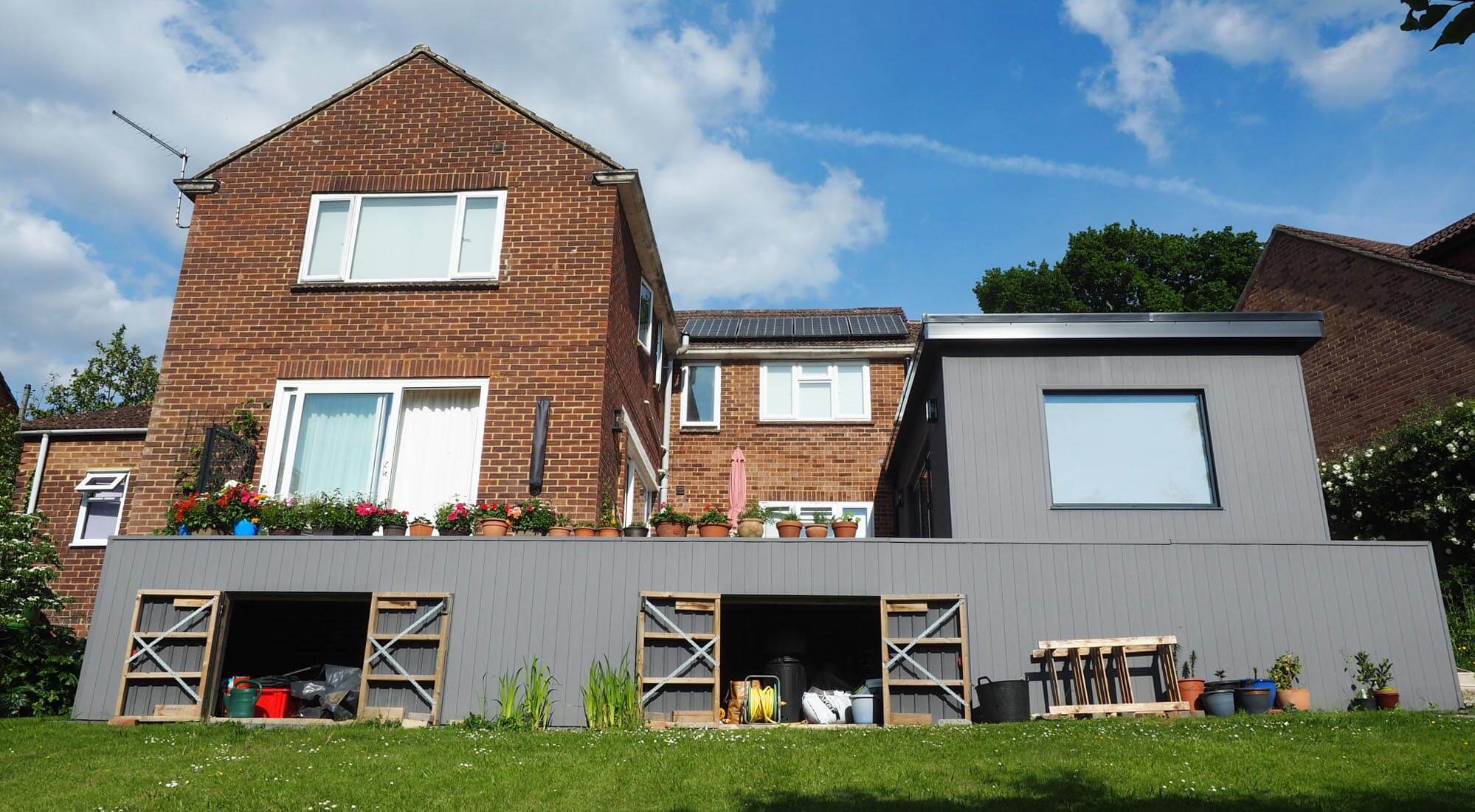 Studio and extended patio storage cladding