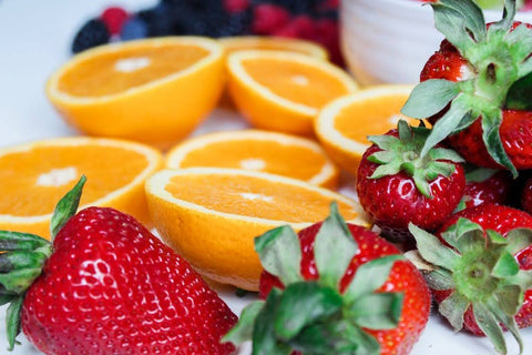 Beauty Comes from Within: The Most Important Nutrients - Strawberries and oranges cut in half