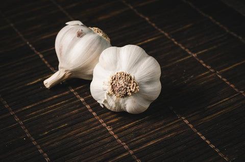 Heart Health After 50: The Best Supplements - Two garlic bulbs