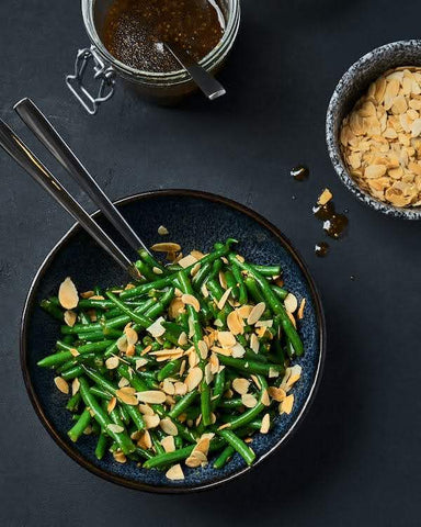 Tasty Twists on Traditional Holiday Dishes - bowl of green bean almondine