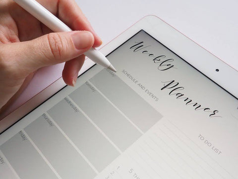 How to Make Your Resolutions Stick - Weekly planner app on ipad, hand holding stylus