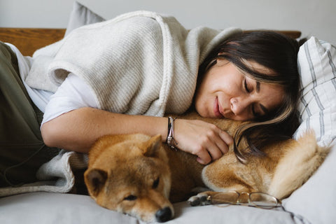 Endurance Products - Woman Sleeping, Cuddling her Dog