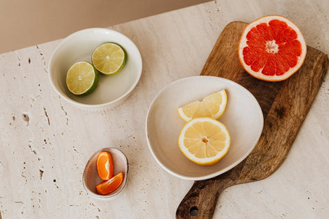 Vitamin C - Cut up oranges, grapefruits, lemons, & limes in bowls