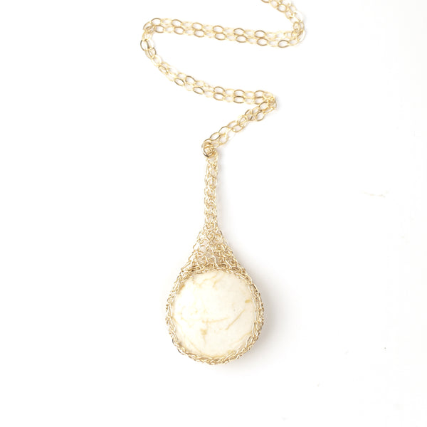 Round IVORY Howlite pendant necklace, nested in gold wire crochet ...