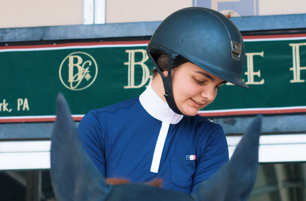 Female equestrian girl smiling