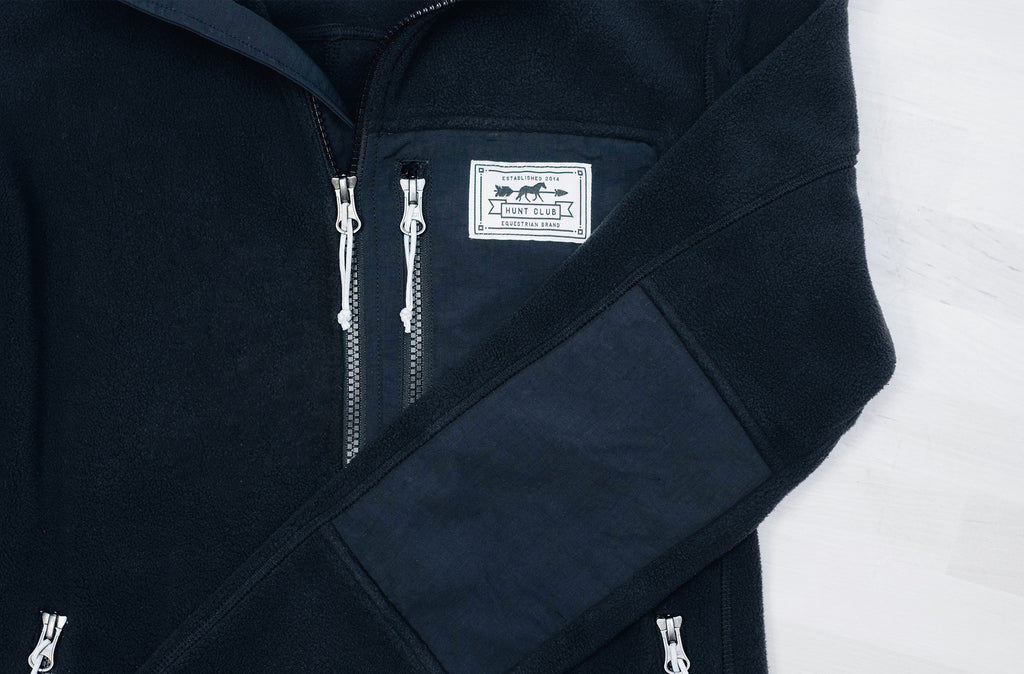 Close-up of details on Hunt Club's black fleece jacket. 